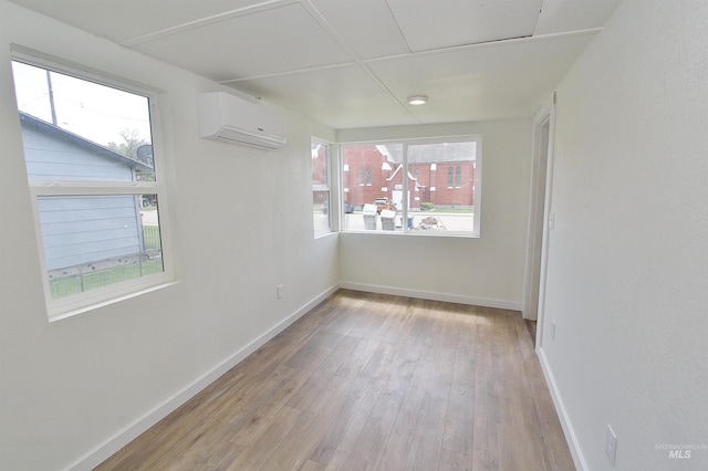 324 Nectarine, Nampa, ID 83686 - empty room with a wall unit AC, wood finished floors, and healthy amount of natural light
