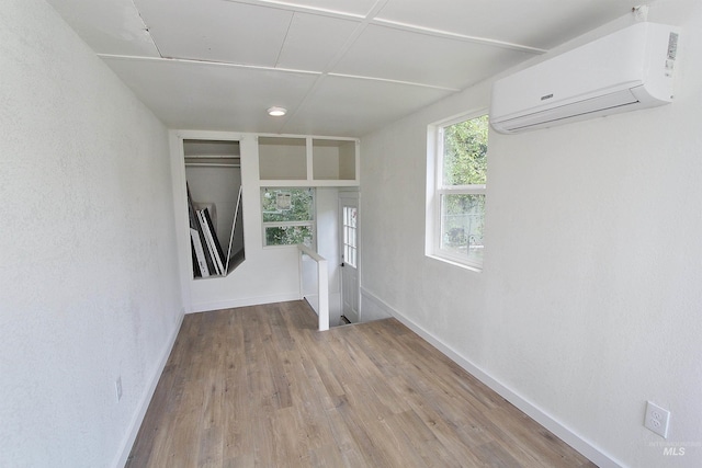 324 Nectarine, Nampa, ID 83686 - spare room with a wall mounted air conditioner and wood finished floors