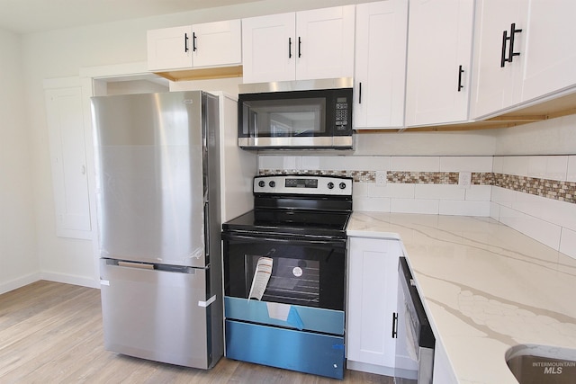 324 Nectarine, Nampa, ID 83686 - kitchen with stainless steel appliances, light wood finished floors, and white cabinets