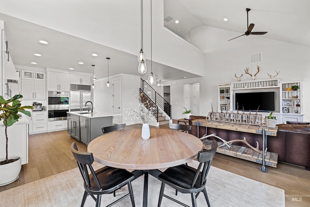 dining room with stairs, recessed lighting, a ceiling fan, and visible vents