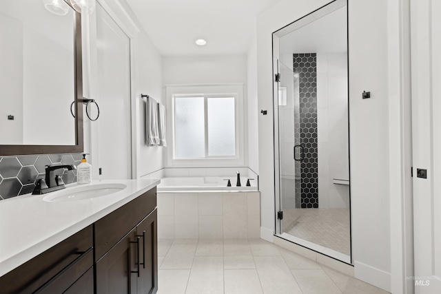 full bathroom with vanity, tile patterned floors, a shower stall, tasteful backsplash, and a bath