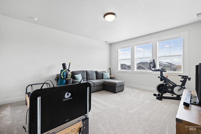 interior space featuring carpet floors, baseboards, and visible vents