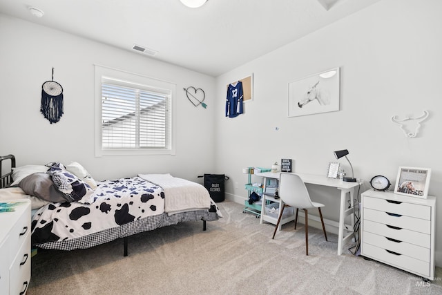 bedroom featuring light colored carpet, baseboards, and visible vents