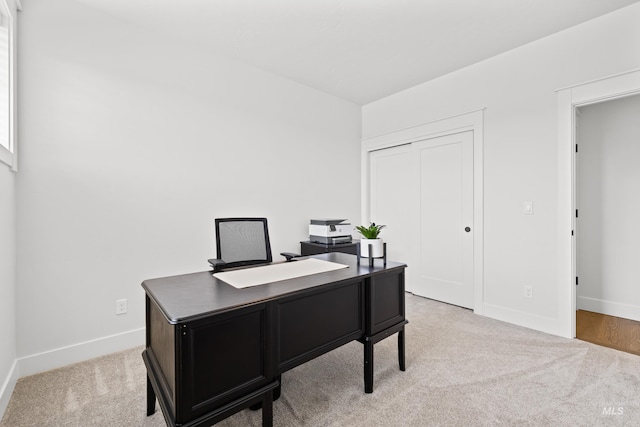 carpeted office with baseboards