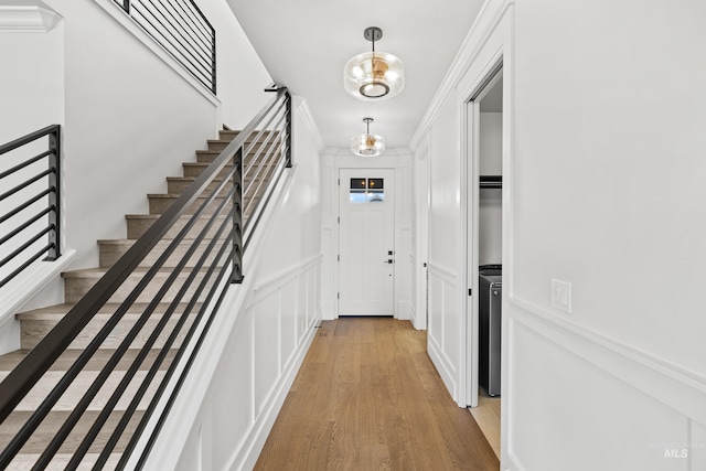 interior space with light wood-style flooring and stairs