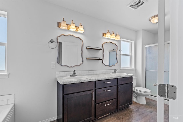 1724 Pioneer Dr, Lewiston, ID 83501 - full bath with double vanity, wood finished floors, a shower with shower door, and a bathtub