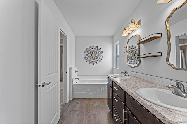 1724 Pioneer Dr, Lewiston, ID 83501 - full bath featuring wood finished floors, double vanity, and a bath