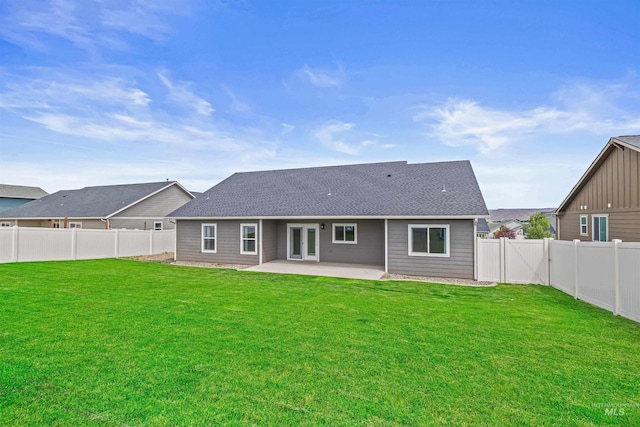 1724 Pioneer Dr, Lewiston, ID 83501 - back of property with a patio area, a fenced backyard, and roof with shingles