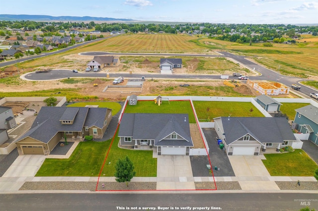 1724 Pioneer Dr, Lewiston, ID 83501 - aerial view of residential area with property boundaries highlighted and mountains