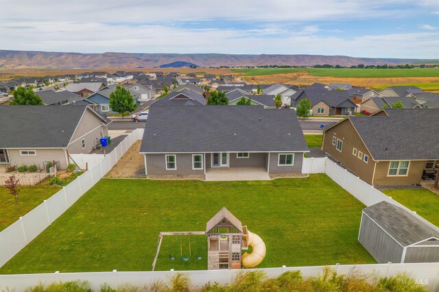 1724 Pioneer Dr, Lewiston, ID 83501 - aerial perspective of suburban area with a mountain backdrop