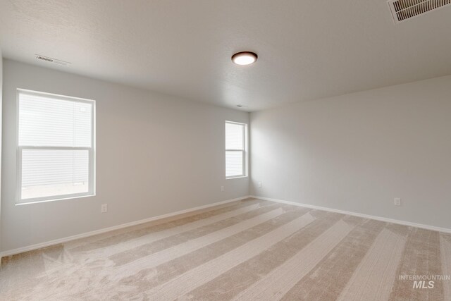 laundry area featuring light hardwood / wood-style floors, hookup for a washing machine, and hookup for an electric dryer