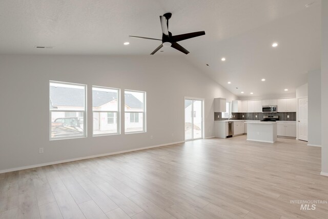 bathroom with vanity, toilet, hardwood / wood-style flooring, and a shower with shower door