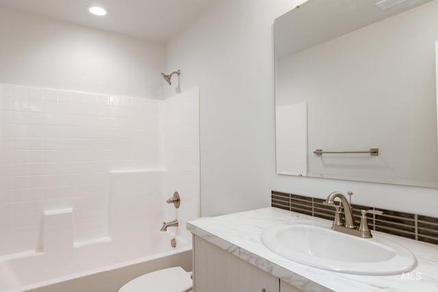 full bathroom featuring toilet, vanity, and shower / bath combination