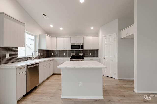 kitchen with tasteful backsplash and stainless steel appliances