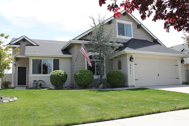4951 W Torana St, Meridian, ID 83646 - view of front of property with roof with shingles, a front lawn, driveway, and a garage