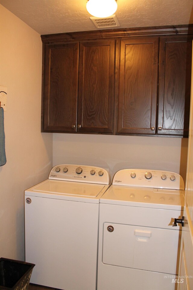 4951 W Torana St, Meridian, ID 83646 - laundry area featuring separate washer and dryer and cabinet space