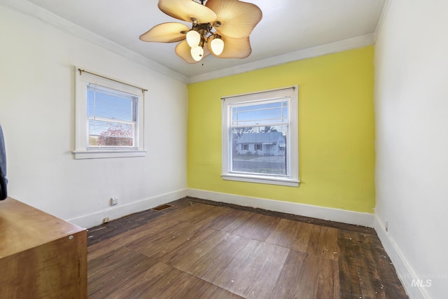 1631 Poplar Ave, Twin Falls, ID 83301 - unfurnished room featuring ornamental molding, a wealth of natural light, and hardwood / wood-style flooring