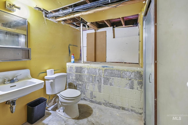 1631 Poplar Ave, Twin Falls, ID 83301 - half bath featuring toilet, a sink, and unfinished concrete floors