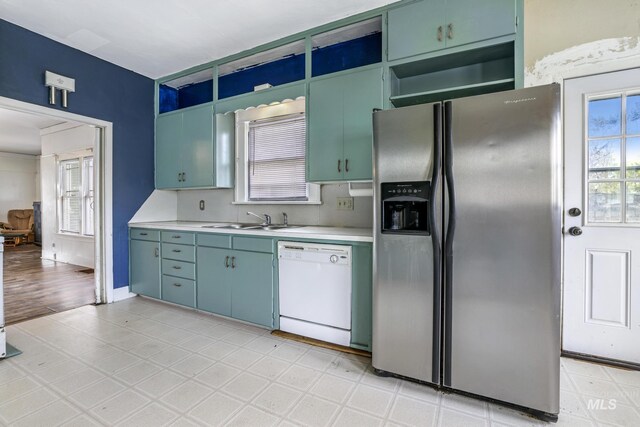 1631 Poplar Ave, Twin Falls, ID 83301 - kitchen with open shelves, stainless steel fridge, a sink, dishwasher, and light countertops