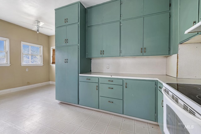 1631 Poplar Ave, Twin Falls, ID 83301 - kitchen with light countertops, white range with electric cooktop, ceiling fan, and baseboards