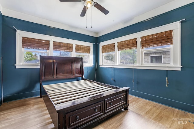 1631 Poplar Ave, Twin Falls, ID 83301 - bedroom featuring baseboards, ceiling fan, and light wood-type flooring