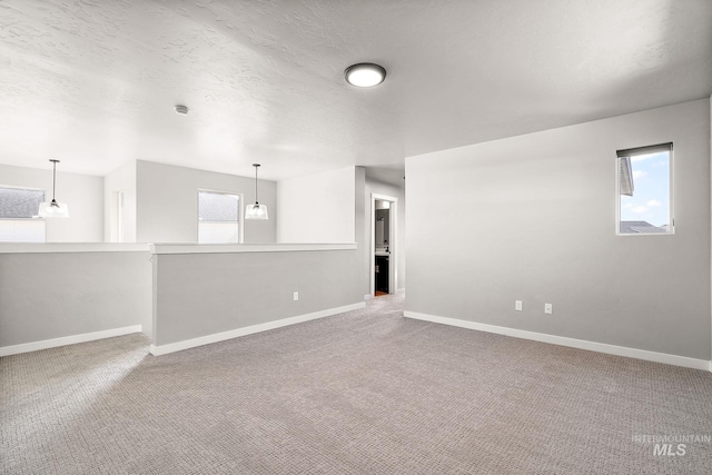 1755 N Crystal Cove Ave, Meridian, ID 83646 - carpeted empty room with baseboards and a textured ceiling