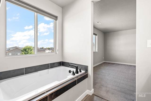 1755 N Crystal Cove Ave, Meridian, ID 83646 - full bathroom featuring a bath and baseboards