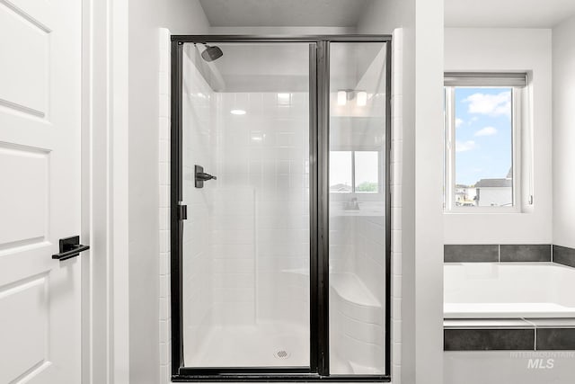 1755 N Crystal Cove Ave, Meridian, ID 83646 - full bathroom featuring a stall shower, a garden tub, and plenty of natural light