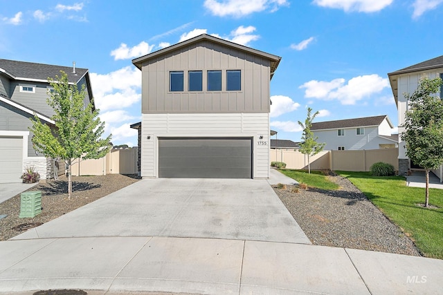 1755 N Crystal Cove Ave, Meridian, ID 83646 - view of front facade with board and batten siding, a garage, and concrete driveway