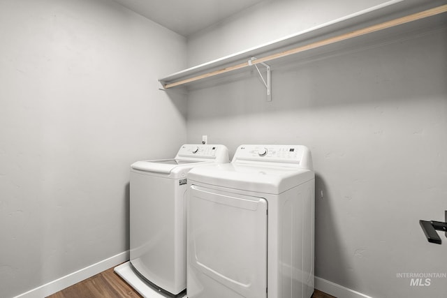 1755 N Crystal Cove Ave, Meridian, ID 83646 - washroom featuring independent washer and dryer and wood finished floors