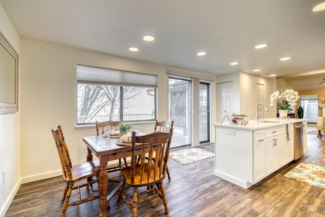 dining room featuring recessed lighting, dark wood finished floors, and baseboards