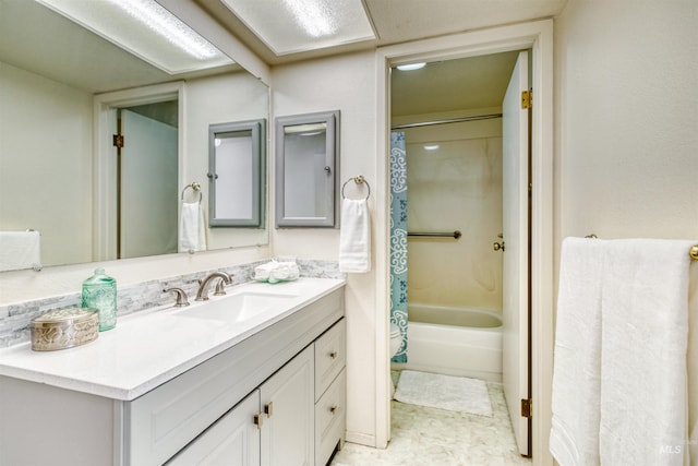 bathroom featuring vanity and shower / bathtub combination with curtain