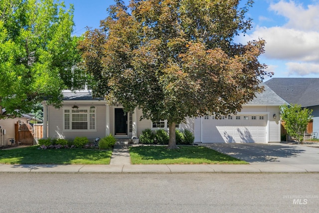 13298 W Meadowdale Dr, Boise, ID 83713 - view of property hidden behind natural elements with a garage, driveway, and a shingled roof