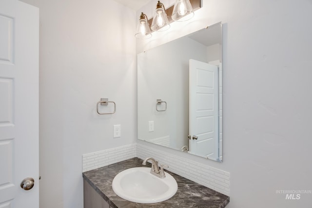 4391 N Magical Creek Ave, Meridian, ID 83646 - bathroom featuring backsplash and vanity