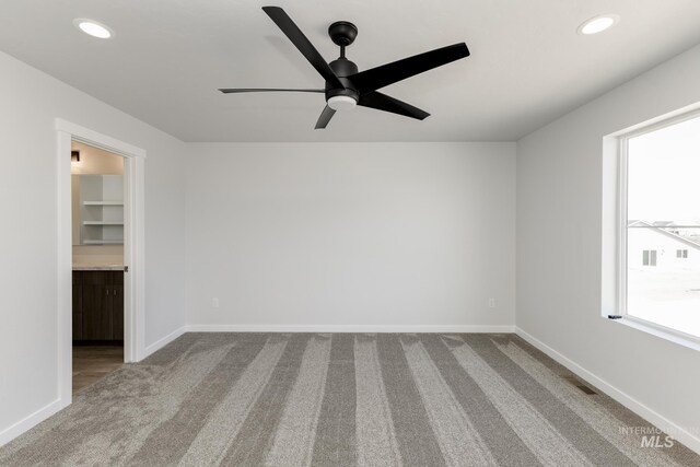 4391 N Magical Creek Ave, Meridian, ID 83646 - empty room featuring recessed lighting, dark colored carpet, baseboards, and ceiling fan