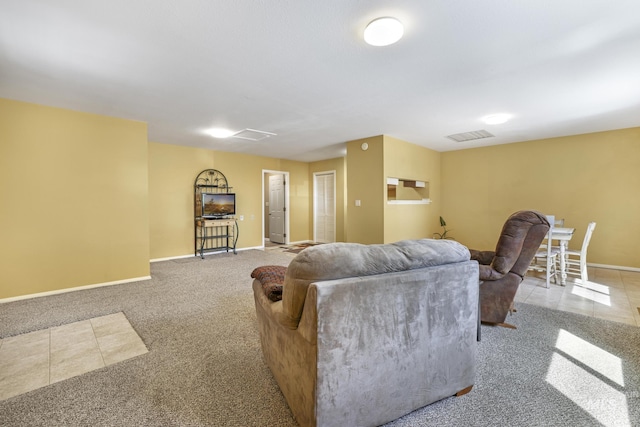 living room with carpet and baseboards