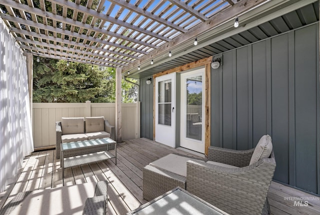 deck featuring a pergola, outdoor lounge area, and fence