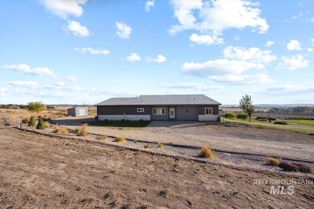 rear view of property featuring a rural view