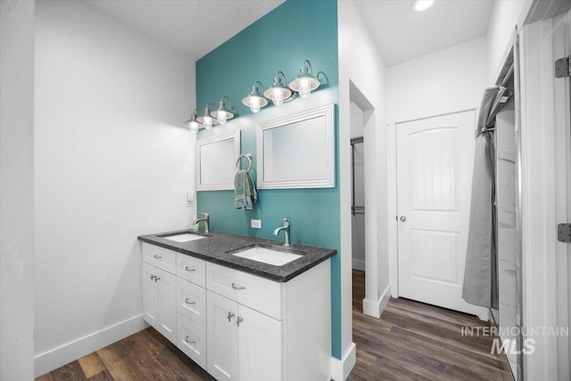 bathroom featuring vanity and wood-type flooring