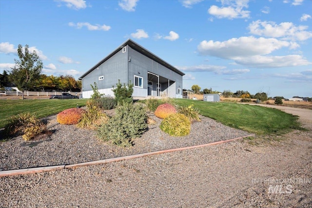 view of property exterior with a yard