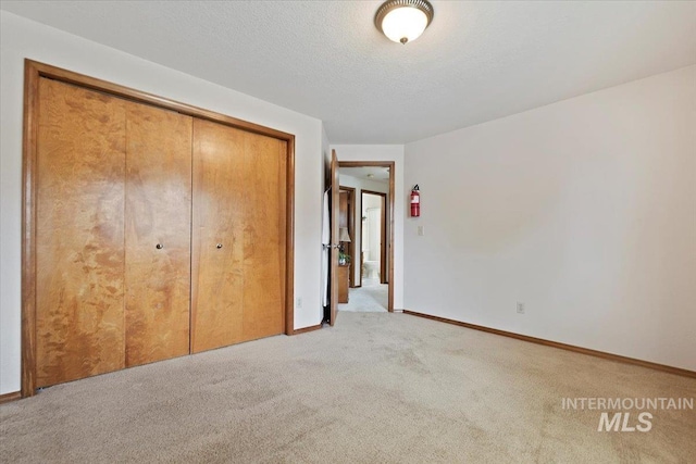 11722 W Jenilyn, Boise, ID 83713 - unfurnished bedroom featuring light colored carpet, a closet, and baseboards