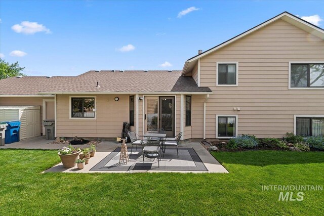 11722 W Jenilyn, Boise, ID 83713 - rear view of property featuring a patio area, a lawn, and roof with shingles