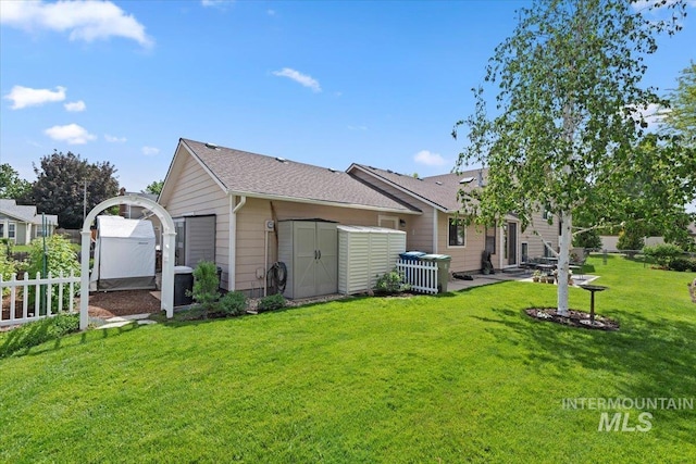 11722 W Jenilyn, Boise, ID 83713 - back of property with an outbuilding, a storage shed, a patio, a shingled roof, and central AC unit