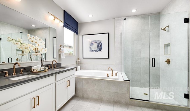 546 Thistle Hills Ave, Middleton, ID 83644 - full bathroom with a sink, double vanity, a stall shower, and a garden tub