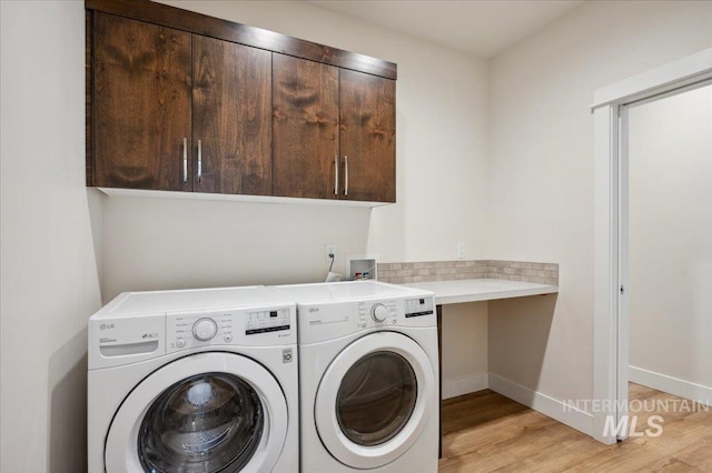 10276 W Utahna Rd, Boise, ID 83714 - laundry room with cabinet space, independent washer and dryer, light wood-style floors, and baseboards