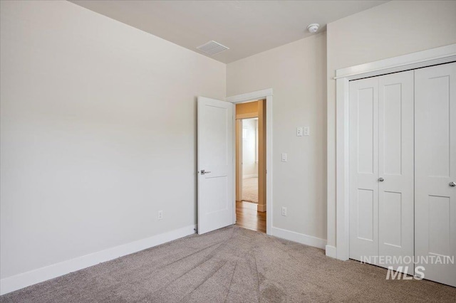 10276 W Utahna Rd, Boise, ID 83714 - unfurnished bedroom with carpet flooring, baseboards, and a closet