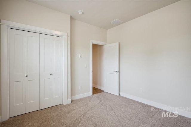 10276 W Utahna Rd, Boise, ID 83714 - unfurnished bedroom featuring carpet flooring, baseboards, and a closet