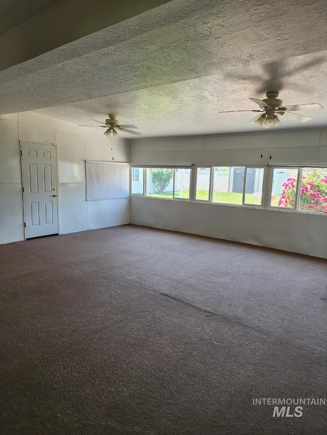 855 N 9th E, Mountain Home, ID 83647 - spare room featuring ceiling fan, carpet floors, and a textured ceiling