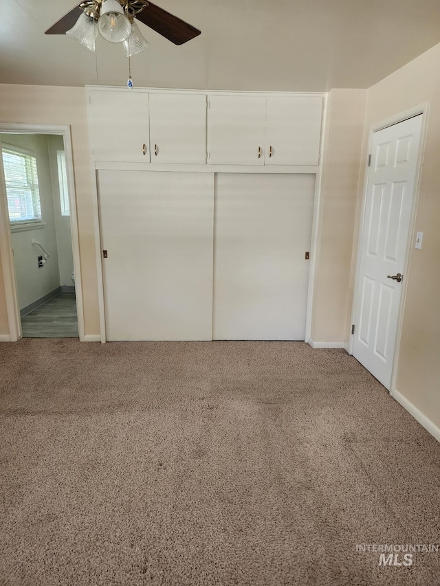 855 N 9th E, Mountain Home, ID 83647 - unfurnished bedroom with carpet, baseboards, a closet, and ceiling fan