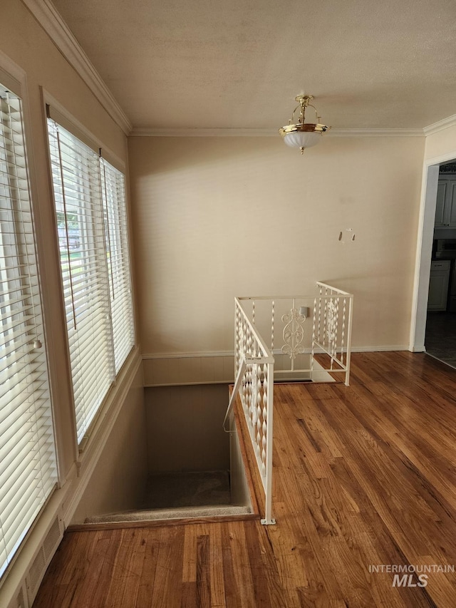 855 N 9th E, Mountain Home, ID 83647 - stairway with wood finished floors, ornamental molding, and baseboards